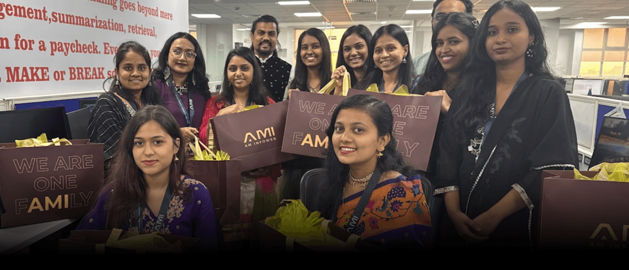 AM Infoweb Diwali celebration showing employees dressed in festive attire during the office cultural event.